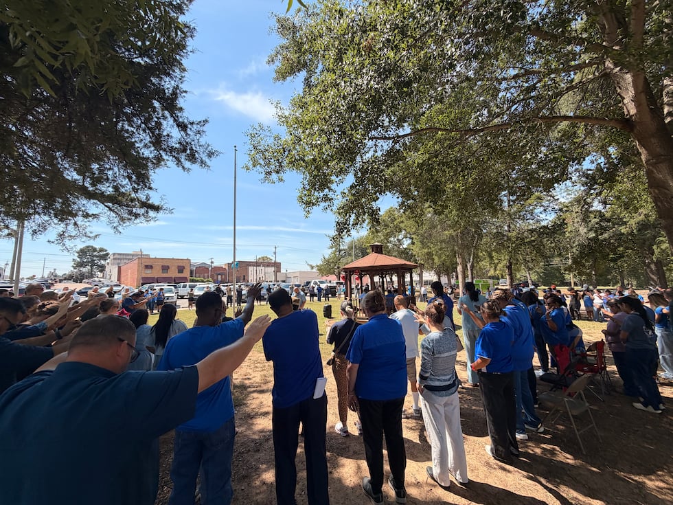 The community turned out in force for the vigil and prayed around the families of all three men.