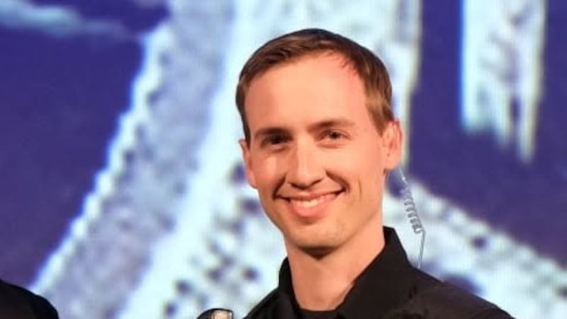Officer Josiah Baxter, shown here in 2021 receiving Life Saving Award