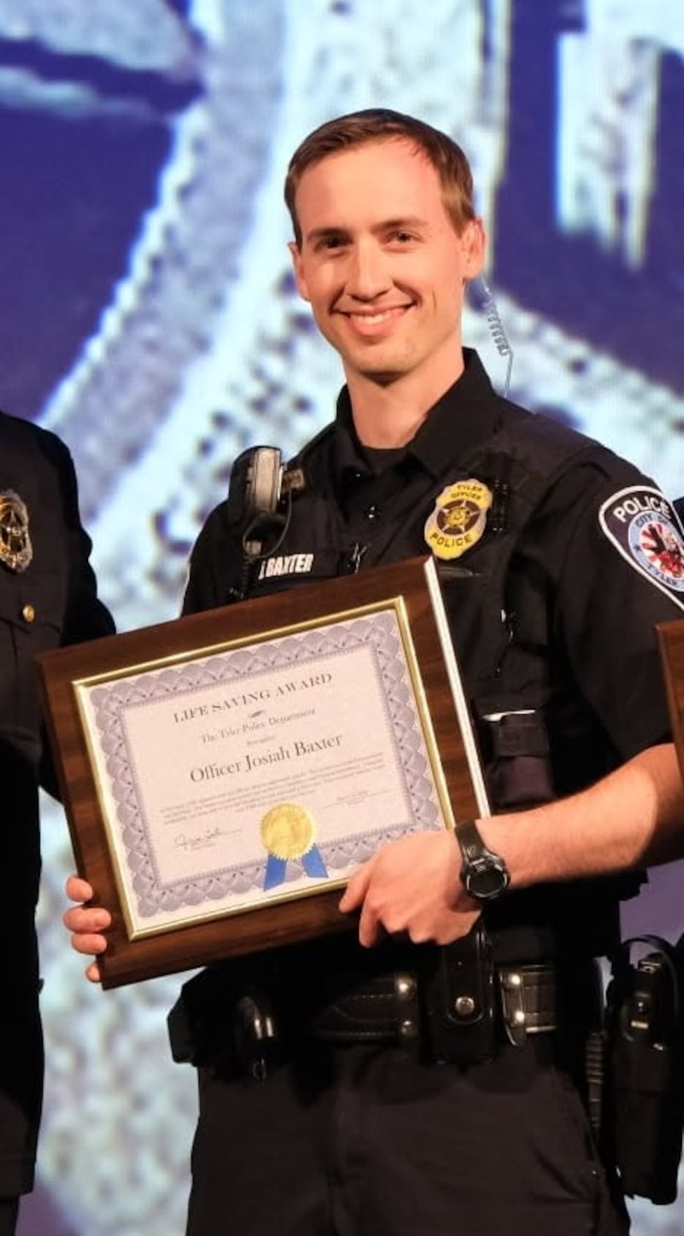 Officer Josiah Baxter, shown here in 2021 receiving Life Saving Award