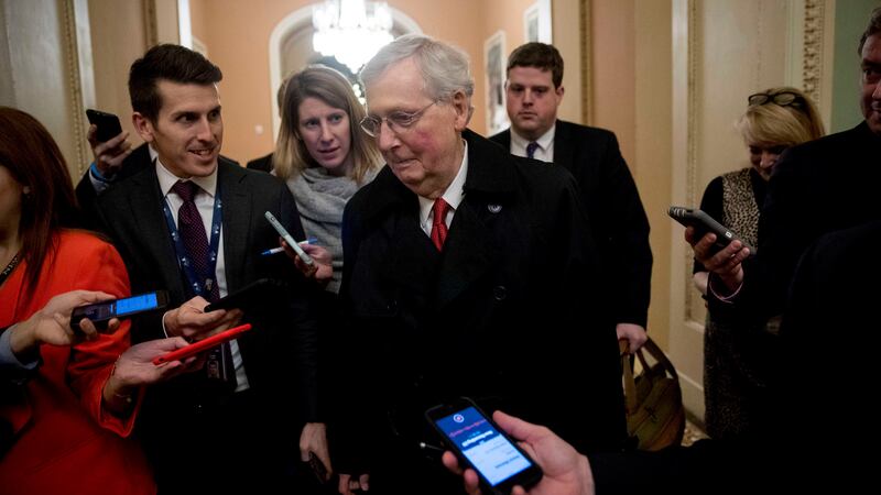 Senate Majority Leader Mitch McConnell leaves for the day after two Senate bills to end the...