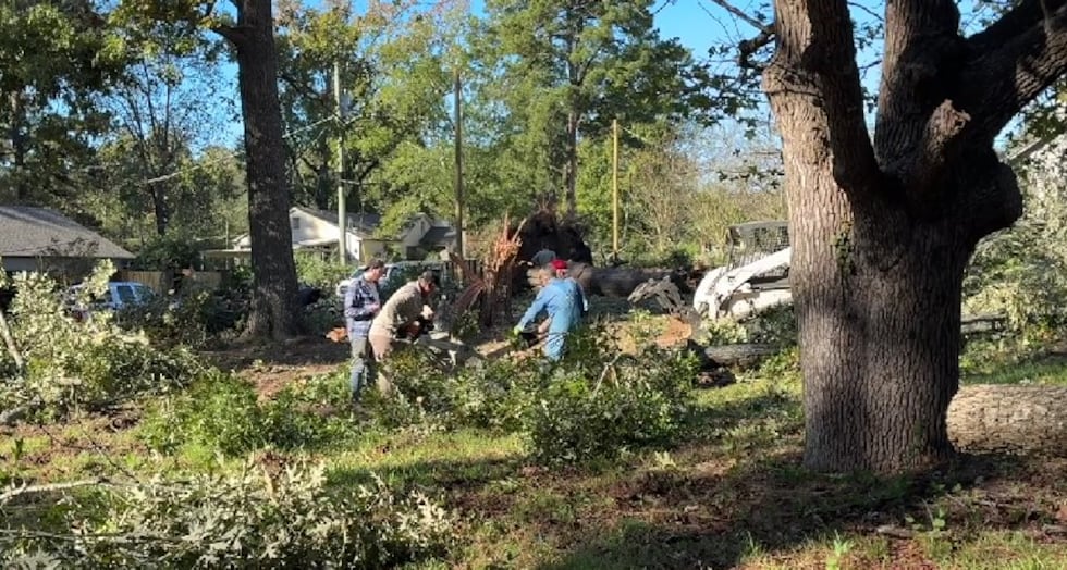 Crews in Kilgore clean up debris from Tuesday storm.