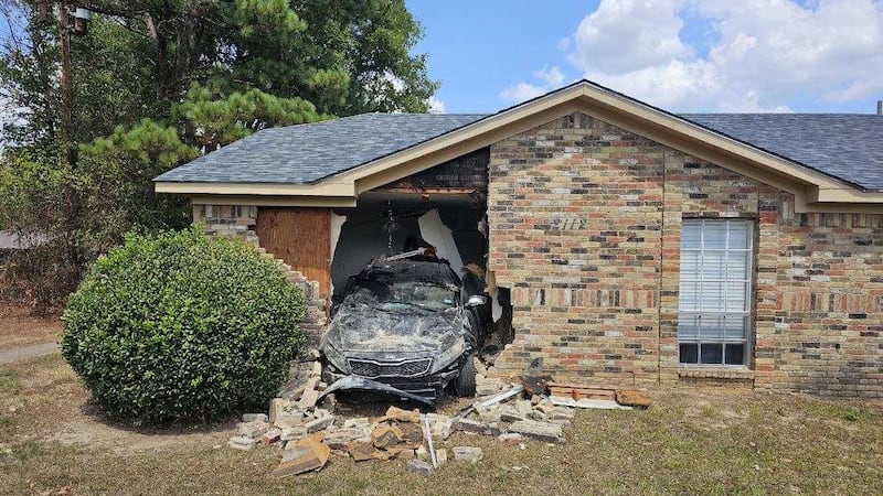 A car damaged two homes in Longview Sunday.