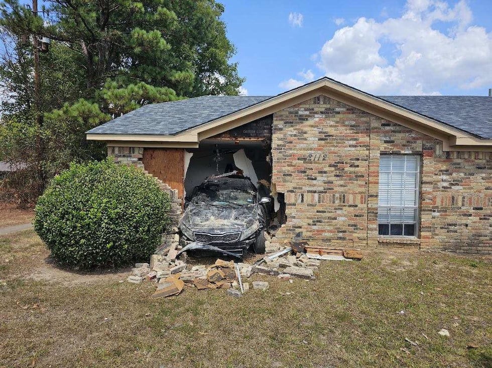 A car damaged two homes in Longview Sunday.