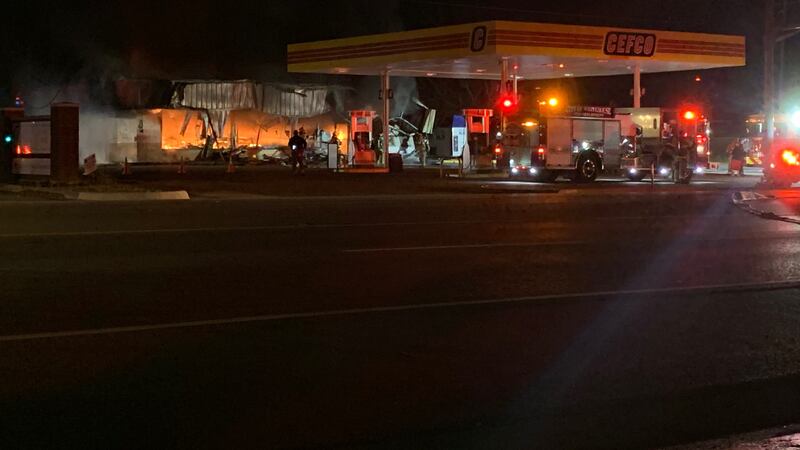 Fire crews work to tame remaining hot spots after large fire at CEFCO gas station in Chapel Hill.