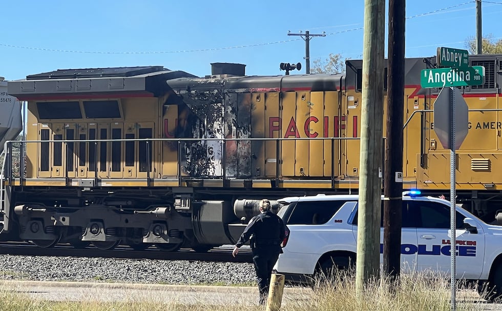 A Lufkin intersection is closed while emergency personnel investigate a train fire.
