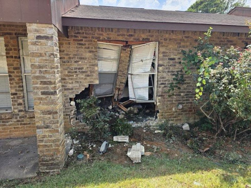 A car damaged two homes in Longview Sunday.