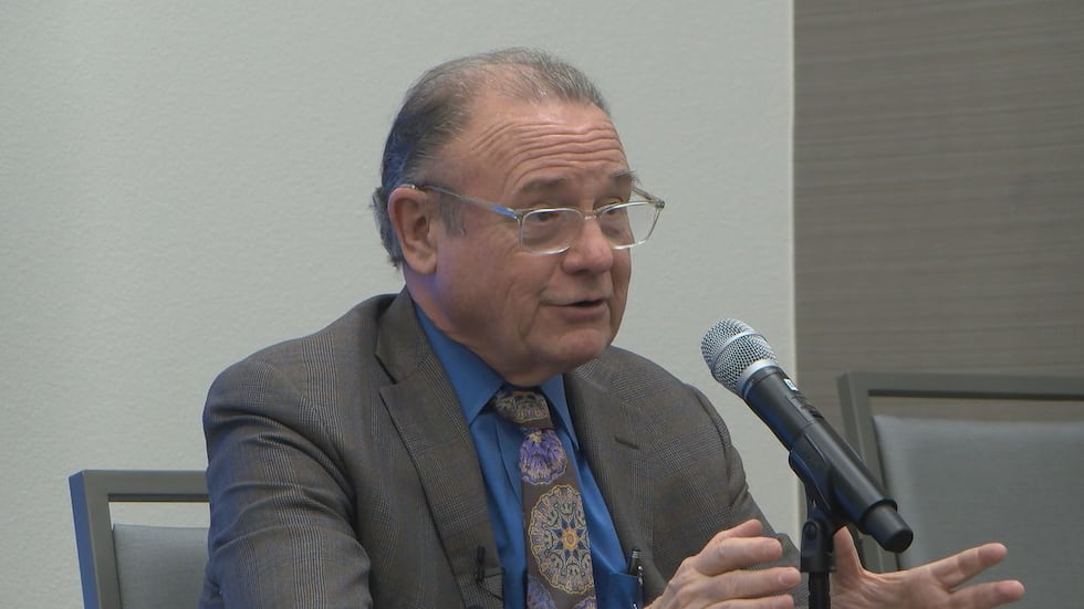 Economist Dr. Ray Perryman speaks to reporters at a news conference in Tyler.