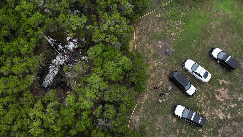 A crashed Cessna airplane is seen in a wooded area on Round Rock Road in Wimberley, Texas,...