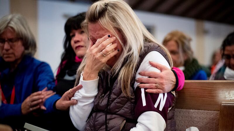 Laura Martin mourns her father, TK Huff, who died during the Camp Fire, during a vigil on...