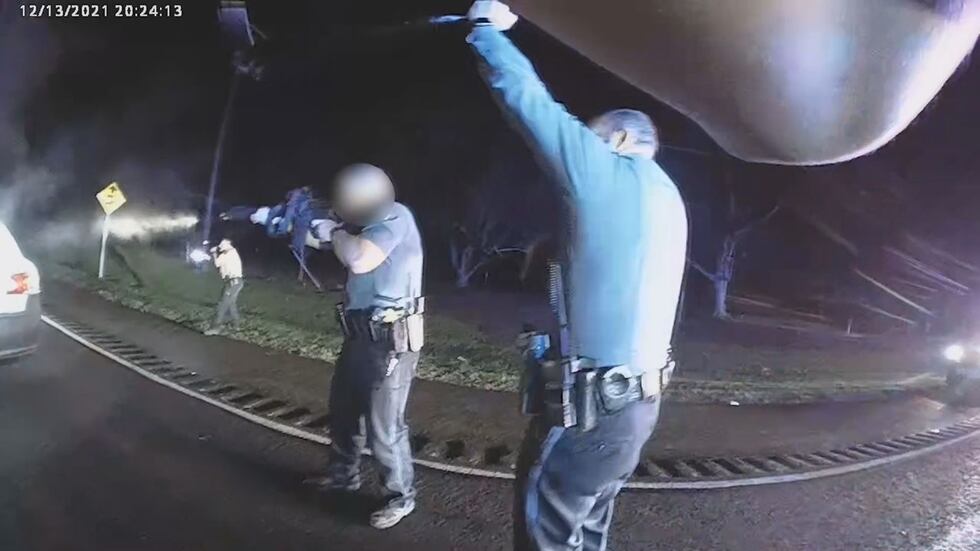 The suspect in a roadside hostage situation is in custody after being shot in the neck by an...
