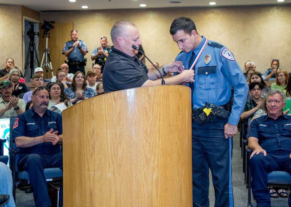 Chief David Thomas presents Lufkin Police officer Christian Ibarra with the Meritorious...