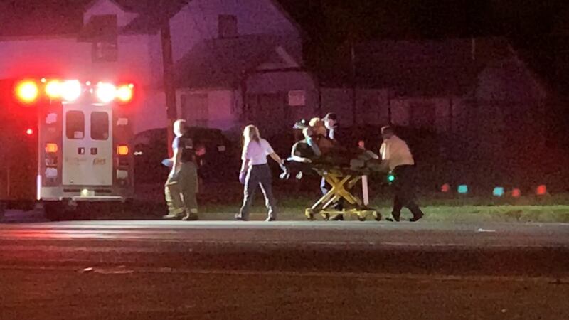 Woman involved in reported crash is taken by EMS officials to hospital via ambulance