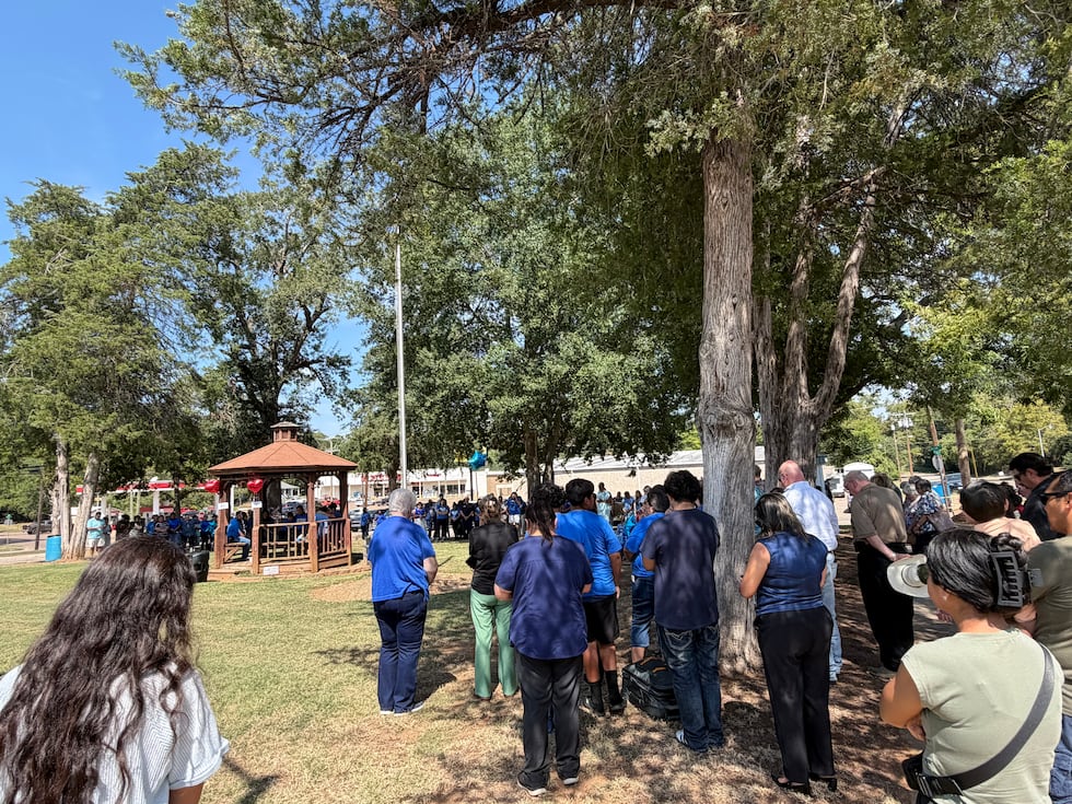 The community turned out in force for the vigil and prayed around the families of all three men.