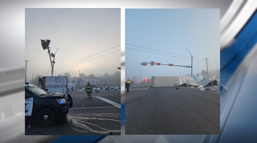 Marshall officials were working to clean up after an 18-wheeler crash and its scattered debris...