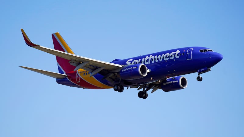 FILE - A Southwest Airlines plane flies low over Gravelly Point on approach to Ronald Reagan...