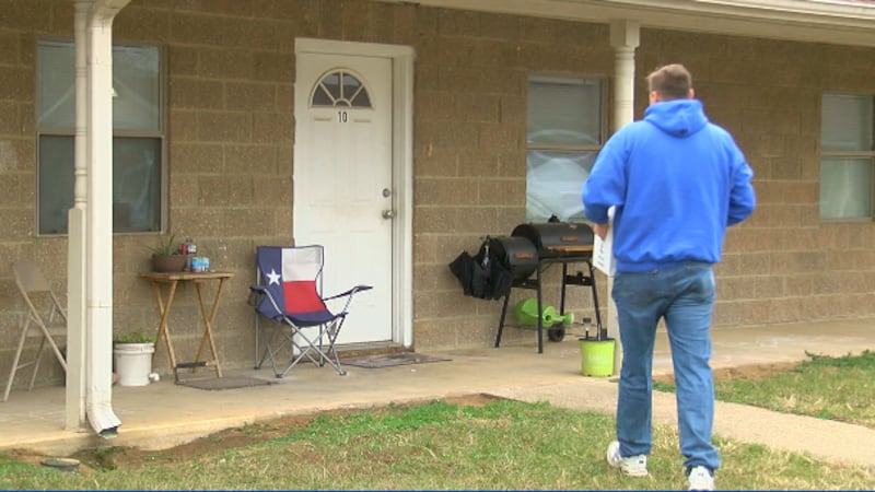 Organizer, Anthony Johnson loads food boxes and gifts to deliver to families in need. Due to...