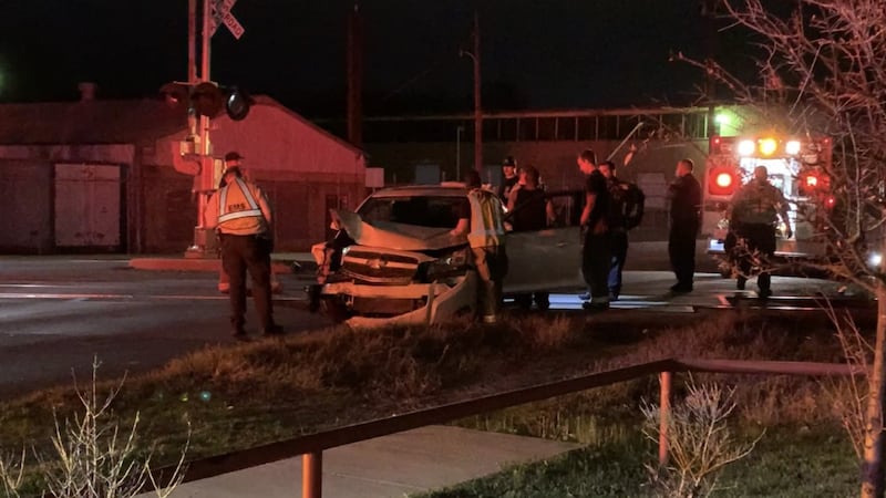 Crews work to clean up N. Palace Ave after a wrecked car comes to a stop.