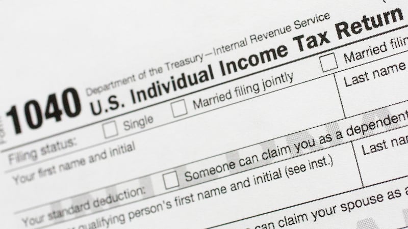 FILE - A portion of the 1040 U.S. Individual Income Tax Return form is shown July 24, 2018, in...