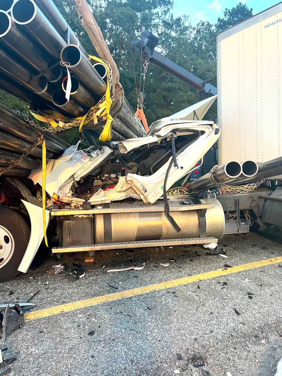 Lufkin firefighters extract trapped 18-wheeler driver from smashed cab following collision