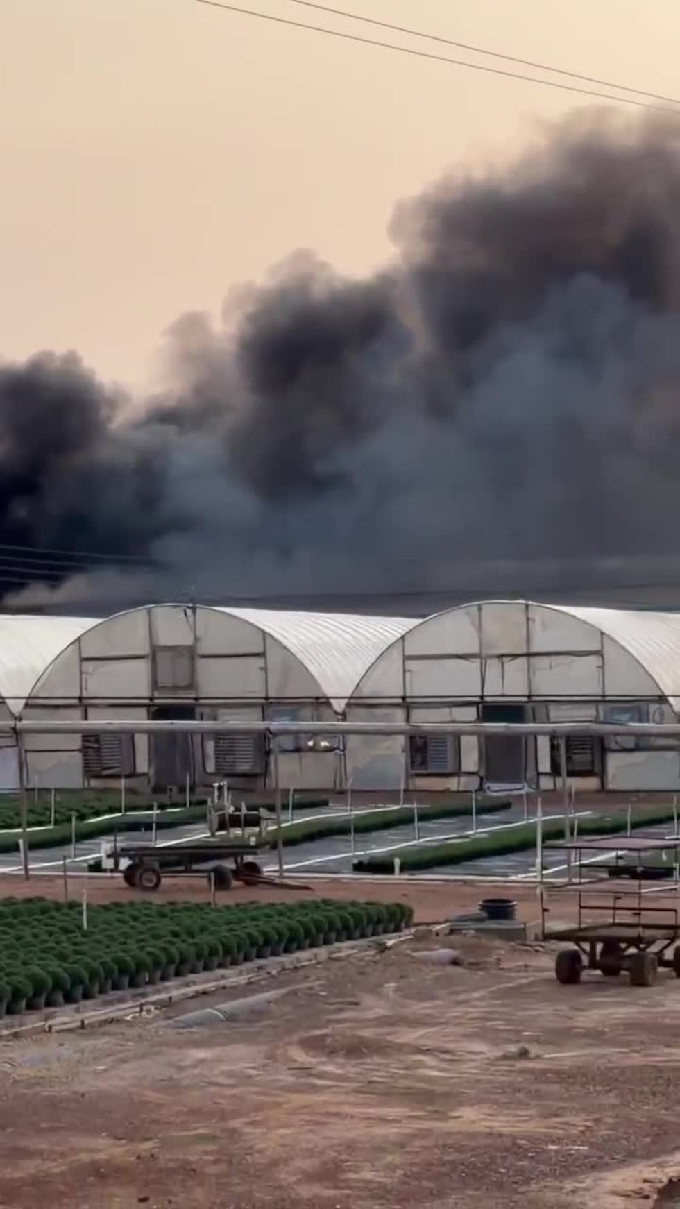WATCH: Smoke billows after flames engulf plant nursery building in Cherokee County