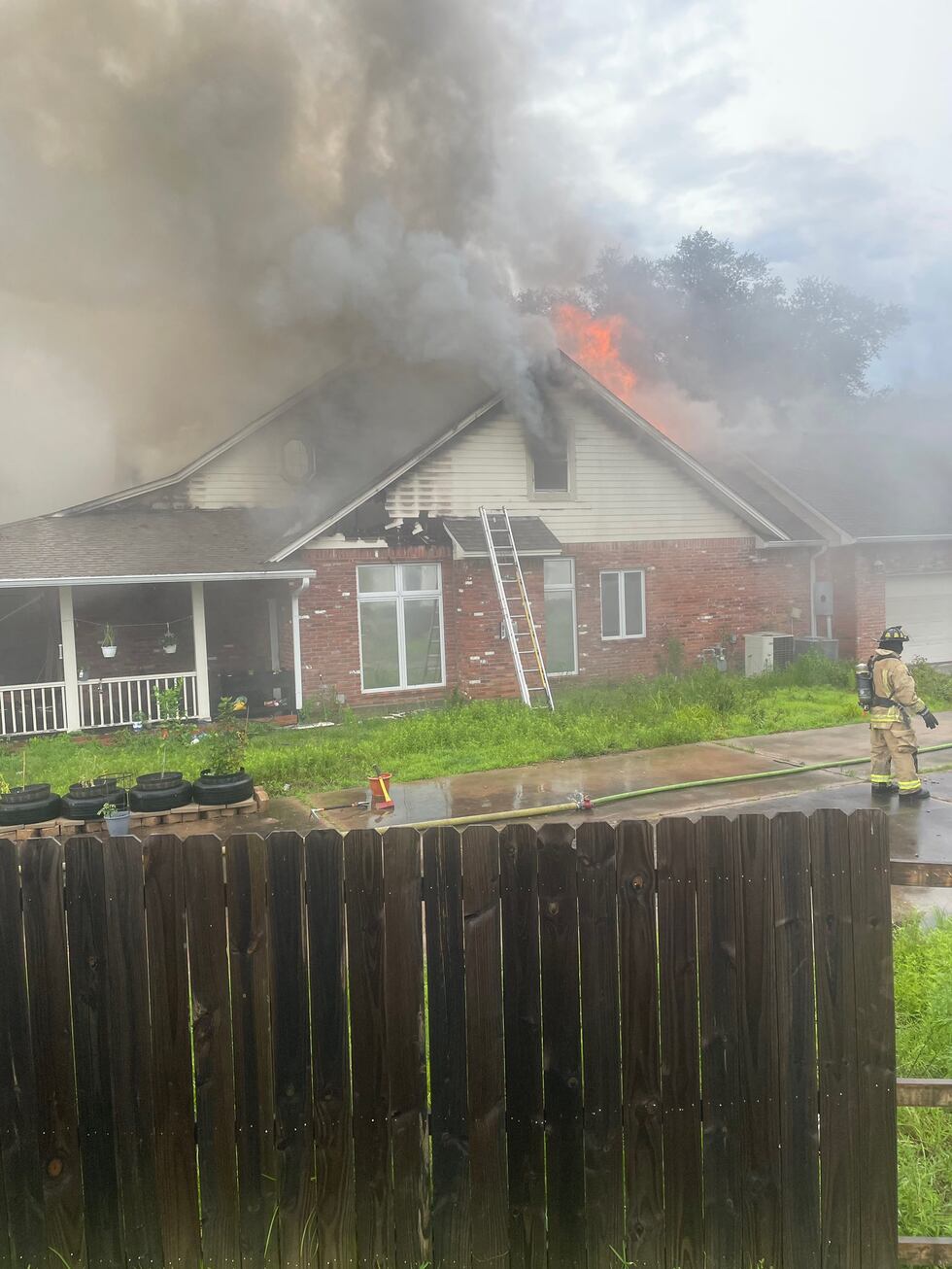 Firefighters are responding to a house fire in a Lufkin neighborhood.