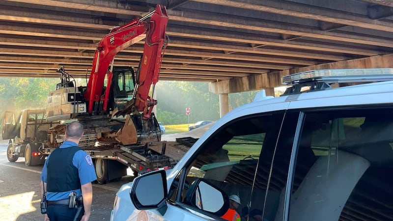 An excavator is blocking traffic after it got stuck under a loop overpass in Lufkin.