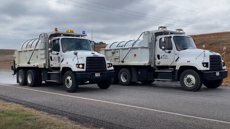 TxDOT trucks applying brine.