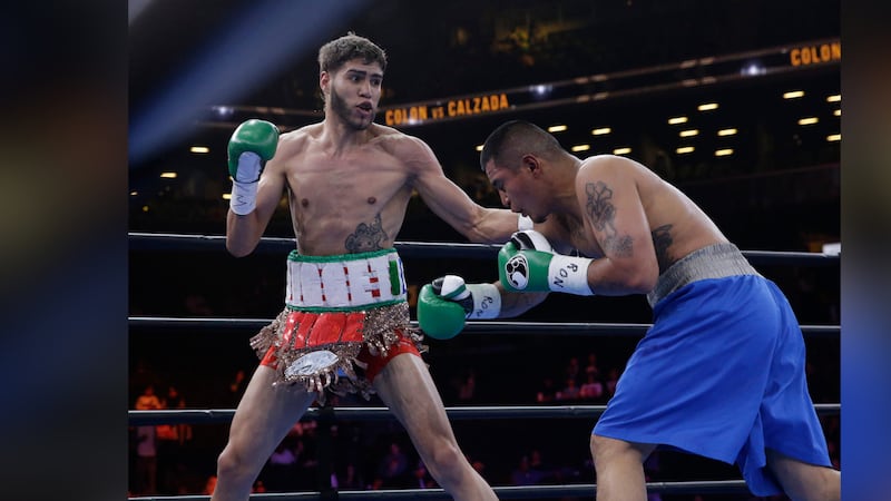 FILE -- Prichard Colon, left, exchanges punches with Daniel Calzada during a junior...