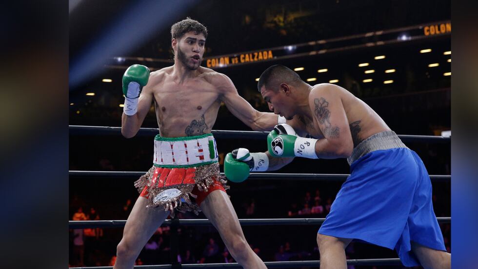 FILE -- Prichard Colon, left, exchanges punches with Daniel Calzada during a junior...