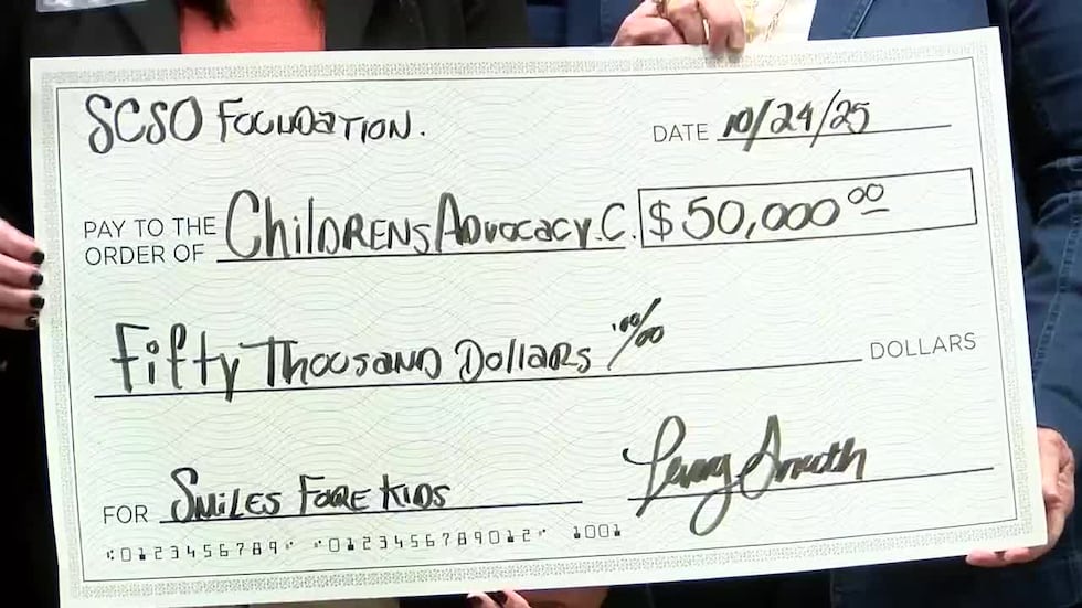 The $50,000 check being the proceeds from the ‘Smiles Fore Kids’ golf tournament last month.