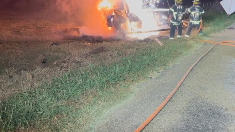 Volunteers arrived to find one vehicle on its side enveloped with heavy fire.