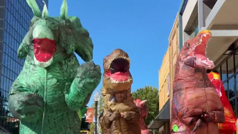 Dinosaurs spotted roaming Tyler square on Halloween