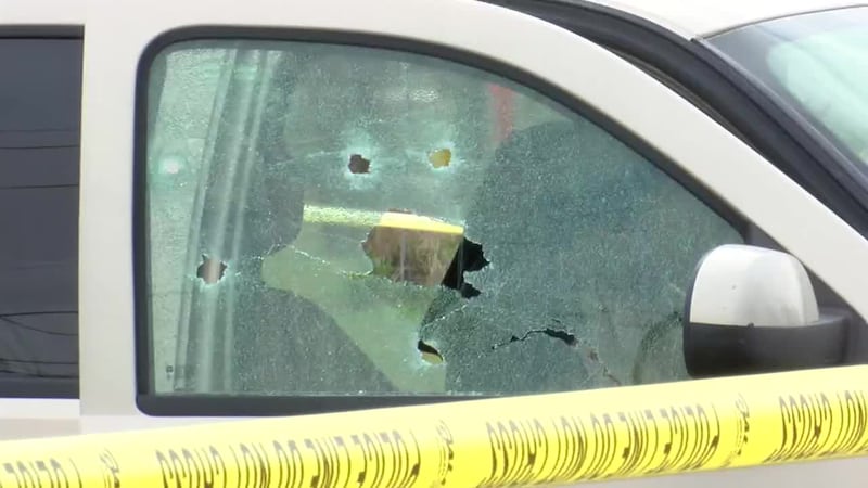 A woman was shot while inside her vehicle at a Henderson intersection and the suspect was...